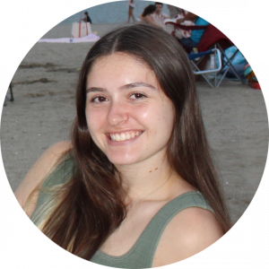 A headshot of Ava Buckmir. She is looking into the camera and smiling